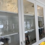beautiful glass front cabinets part of the renovation of this kitchen area. lights