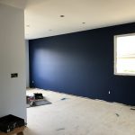 progress of a renovation, flooring and ceiling pot lights