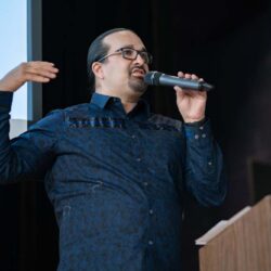 speaker gesturing hapily