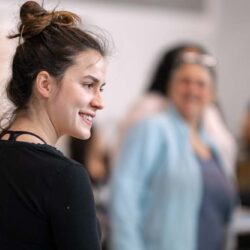 woman smiling and dancing