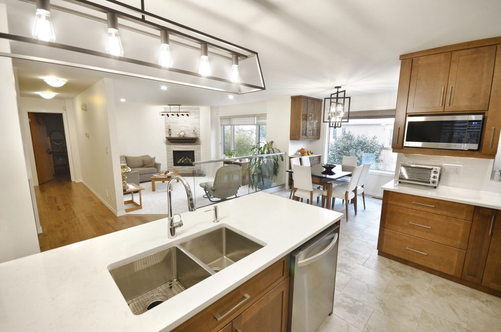 beautiful designer lighting are the focal points of this beautiful home renovation