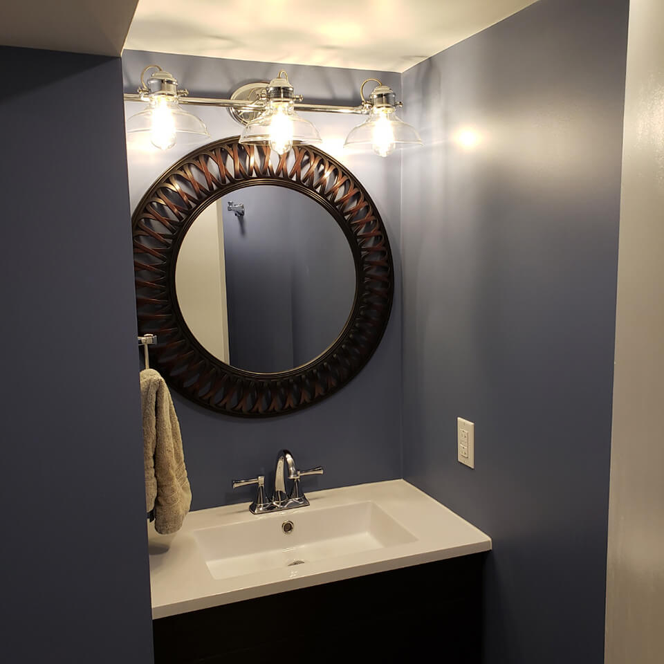 dramatic lighting in this Basement Bathroom - Winnipeg Bathroom Renovations - All Canadian Renovations Ltd.